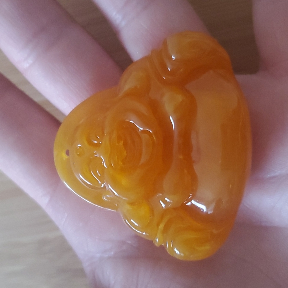 New Carved Man-Made Amber Buddha Pendant.